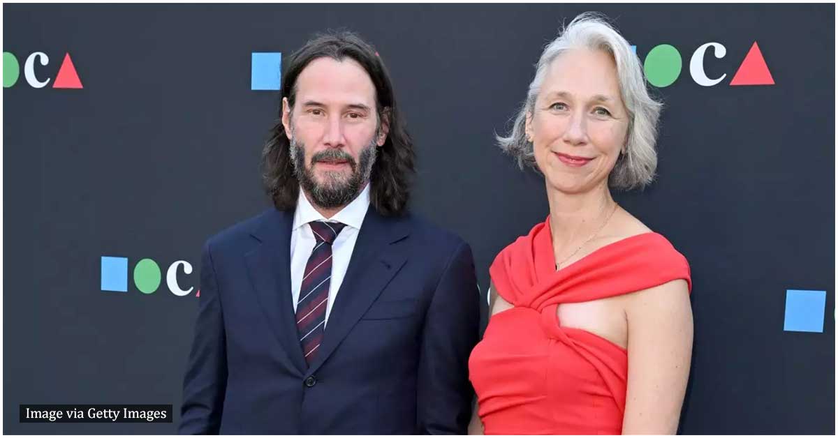 Keanu Reeves smiles in a rare public appearance with his girlfriend
