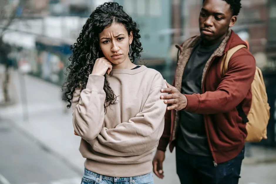 A person looking thoughtfully at their phone, reflecting on the meaning of "Your Ex Unblocked You."