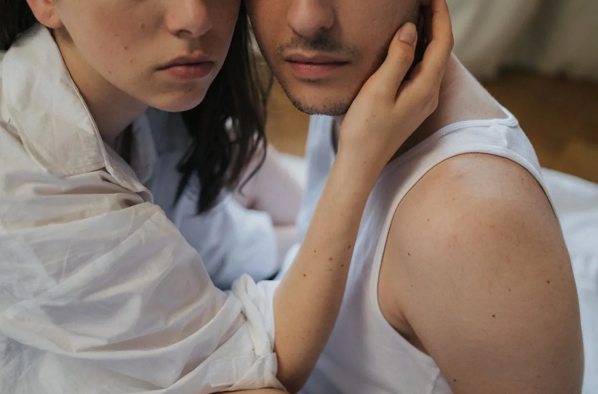 Young couple sharing a tender moment, illustrating different love language types.