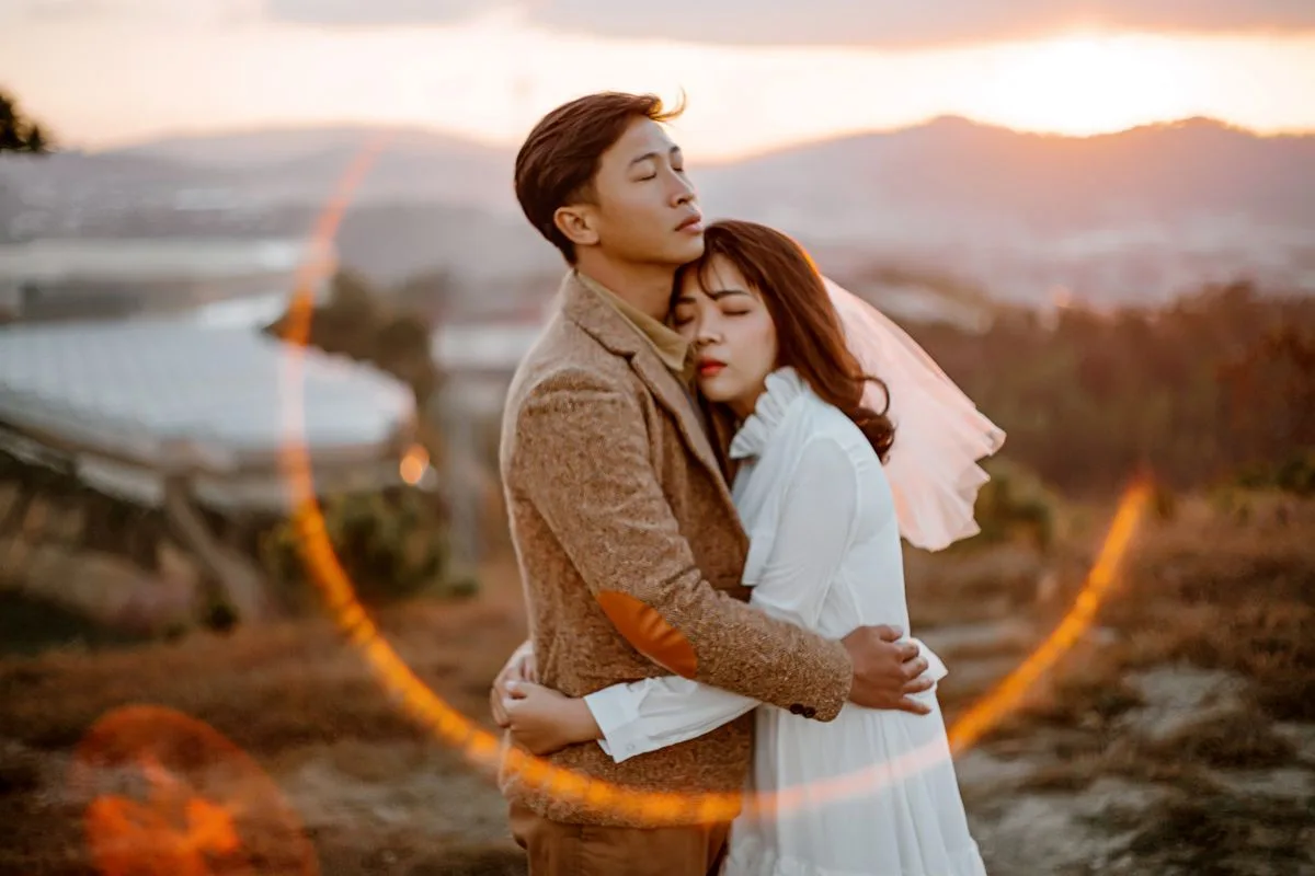 Couple embracing in nature, exploring the honey meaning in love on their wedding day.